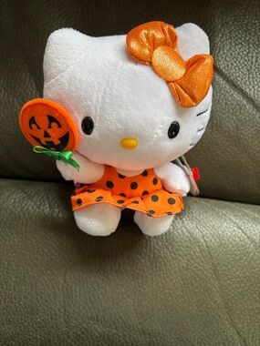 Hello kitty adorable Halloween kitty holding pumpkin lollipop
